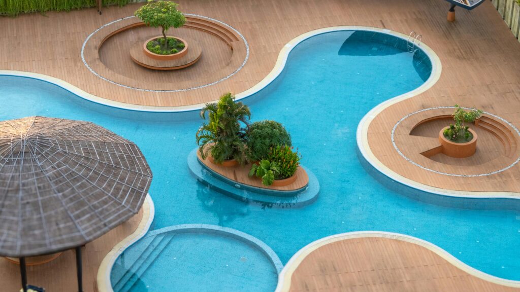 A modern pool design with unique landscaping featuring elevated planters in Cox's Bazar, Bangladesh.
